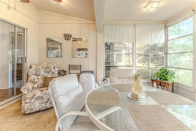 a view of a house with a backyard and a patio