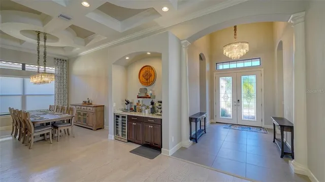 a kitchen with stainless steel appliances granite countertop a sink refrigerator and cabinets