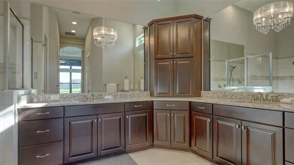 a patio with a table and chairs under an umbrella