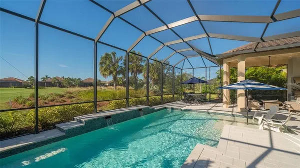 a view of a swimming pool with a yard