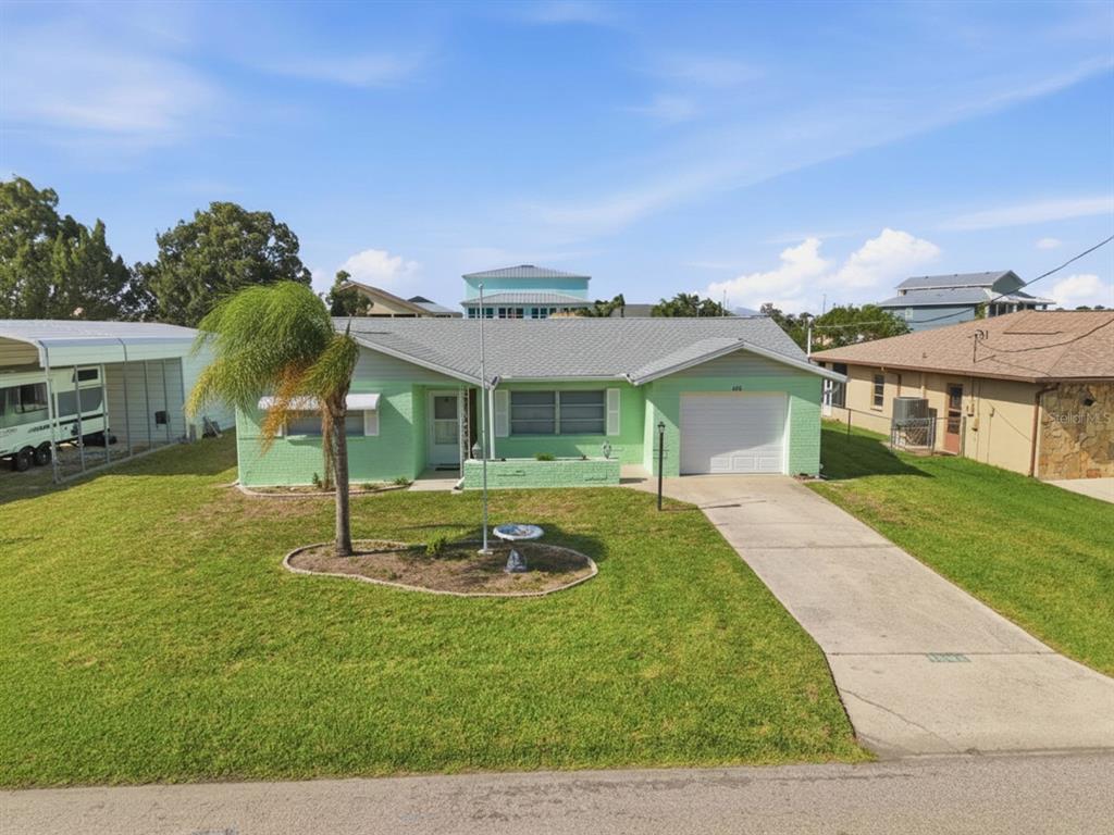 a front view of a house with a yard