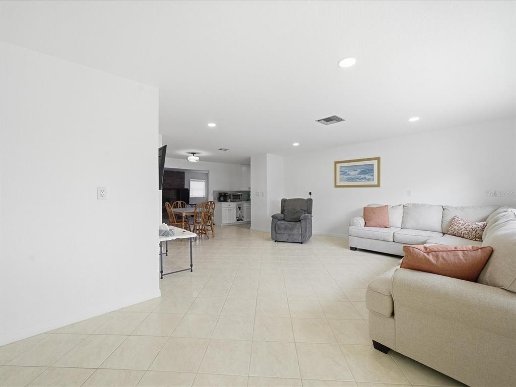 4069 Gulfview Drive Hernando Beach, FL 34607 - Photo 11 of 29 a living room with furniture and a table