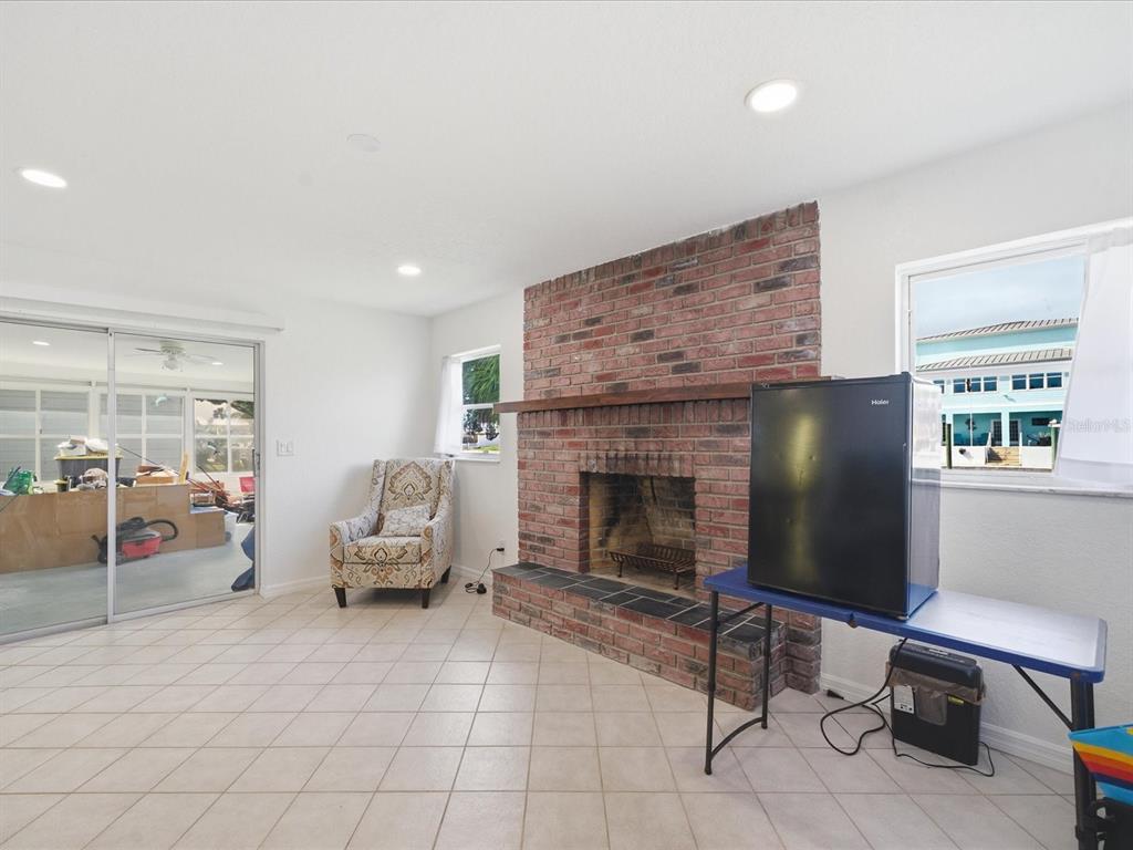 4069 Gulfview Drive Hernando Beach, FL 34607 - Photo 14 of 29 a living room with furniture and a fireplace