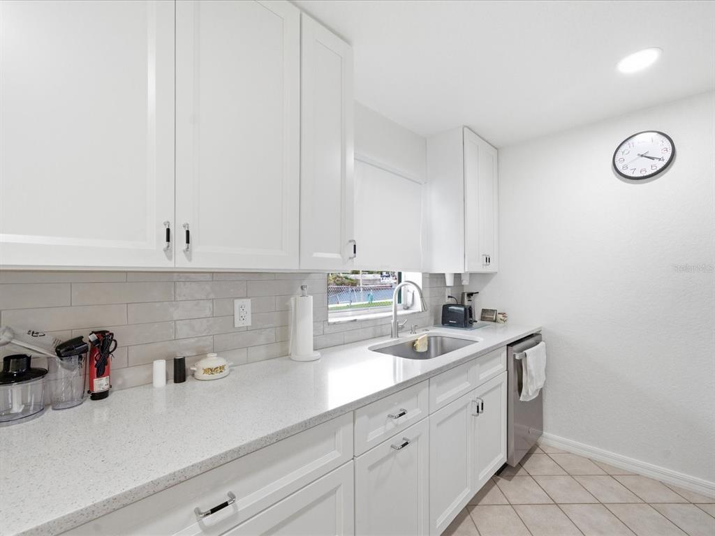 4069 Gulfview Drive Hernando Beach, FL 34607 - Photo 18 of 29 a kitchen with cabinets stainless steel appliances and sink