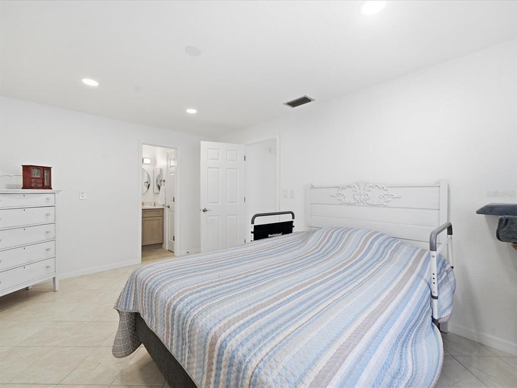 4069 Gulfview Drive Hernando Beach, FL 34607 - Photo 21 of 29 a bedroom with a bed and a closet