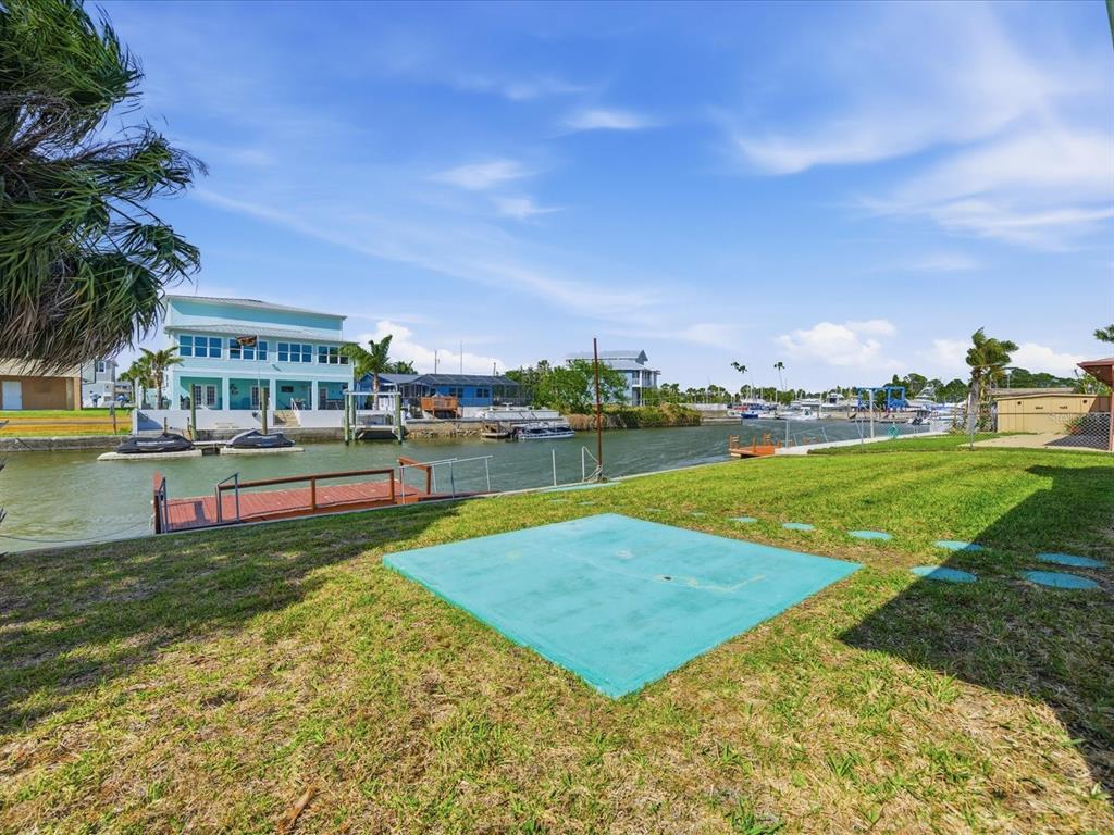 4069 Gulfview Drive Hernando Beach, FL 34607 - Photo 5 of 29 a view of a swimming pool and a yard