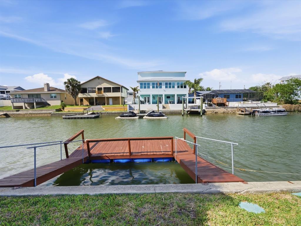 4069 Gulfview Drive Hernando Beach, FL 34607 - Photo 8 of 29 a view of a lake with a house in the background