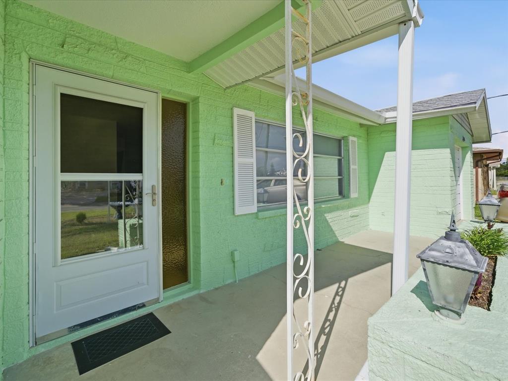 4069 Gulfview Drive Hernando Beach, FL 34607 - Photo 9 of 29 a bedroom with a bed and a fireplace