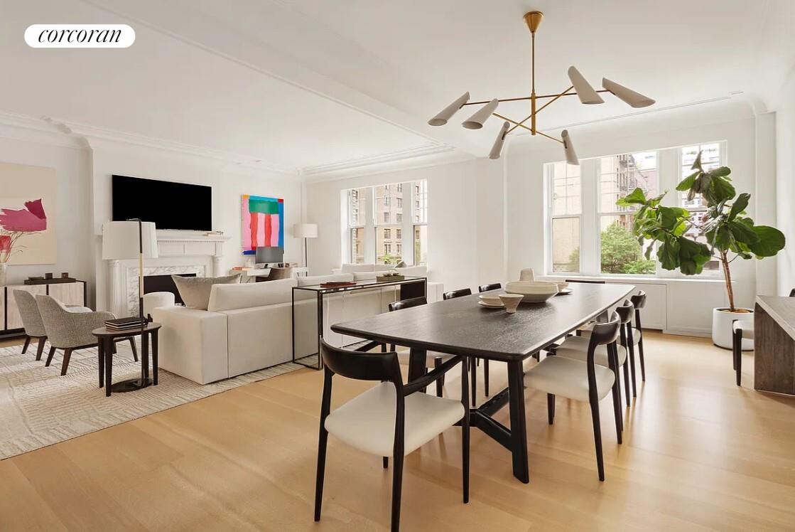 875 Park Avenue, Unit 4C Manhattan, NY 10075 - Photo 3 of 13 a view of a dining room with furniture and wooden floor