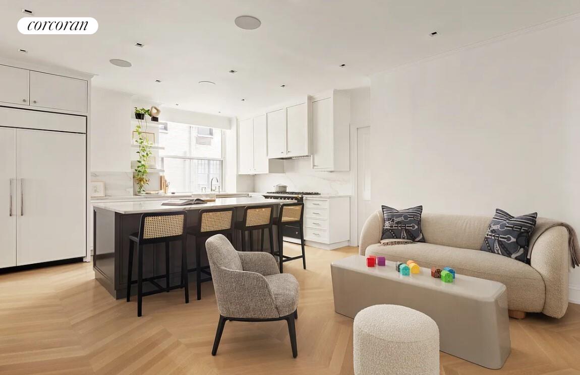 875 Park Avenue, Unit 4C Manhattan, NY 10075 - Photo 5 of 13 a living room with furniture and a wooden floor