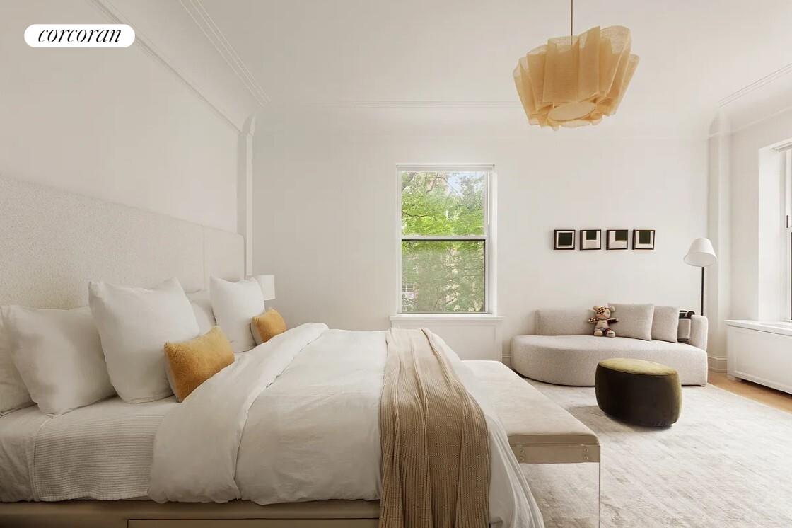 875 Park Avenue, Unit 4C Manhattan, NY 10075 - Photo 6 of 13 a bedroom with a bed and a couch