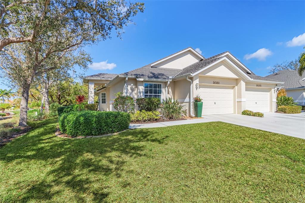 2031 Matecumbe Key Road Punta Gorda, FL 33955 - Photo 1 of 49 a front view of a house with garden