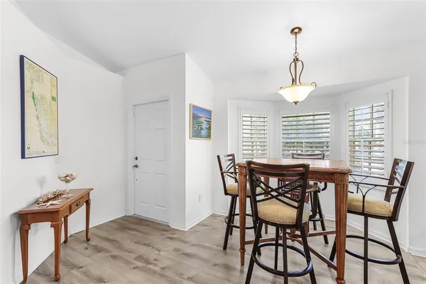 a bed room with a bed and a lamp