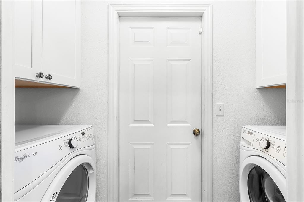 2031 Matecumbe Key Road Punta Gorda, FL 33955 - Photo 22 of 49 a view of storage and utility room with washer and dryer