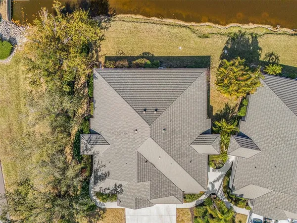 an aerial view of residential building and ocean