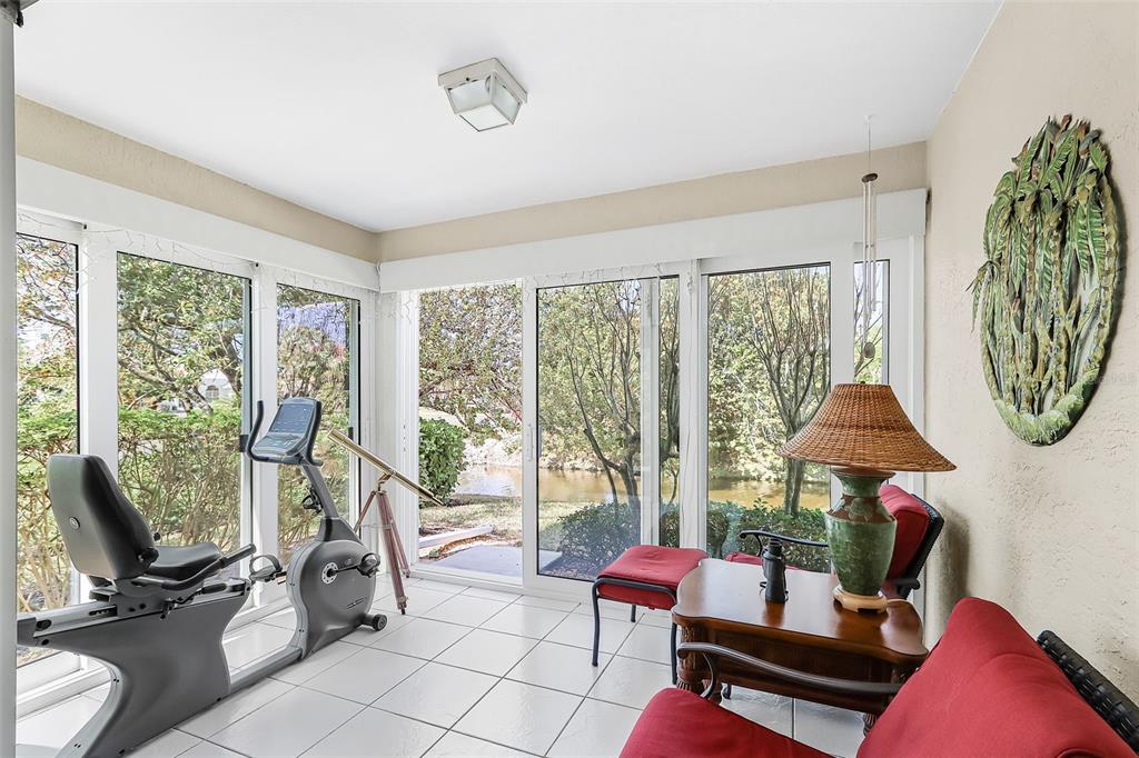 2031 Matecumbe Key Road Punta Gorda, FL 33955 - Photo 4 of 49 a living room with furniture and a floor to ceiling window