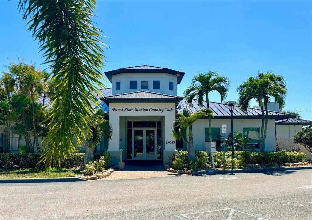 2031 Matecumbe Key Road Punta Gorda, FL 33955 - Photo 41 of 49 a front view of a house with a garden