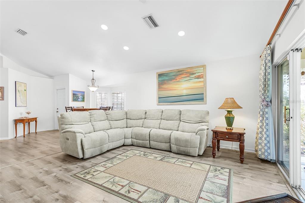 2031 Matecumbe Key Road Punta Gorda, FL 33955 - Photo 9 of 49 a living room with furniture and a chandelier