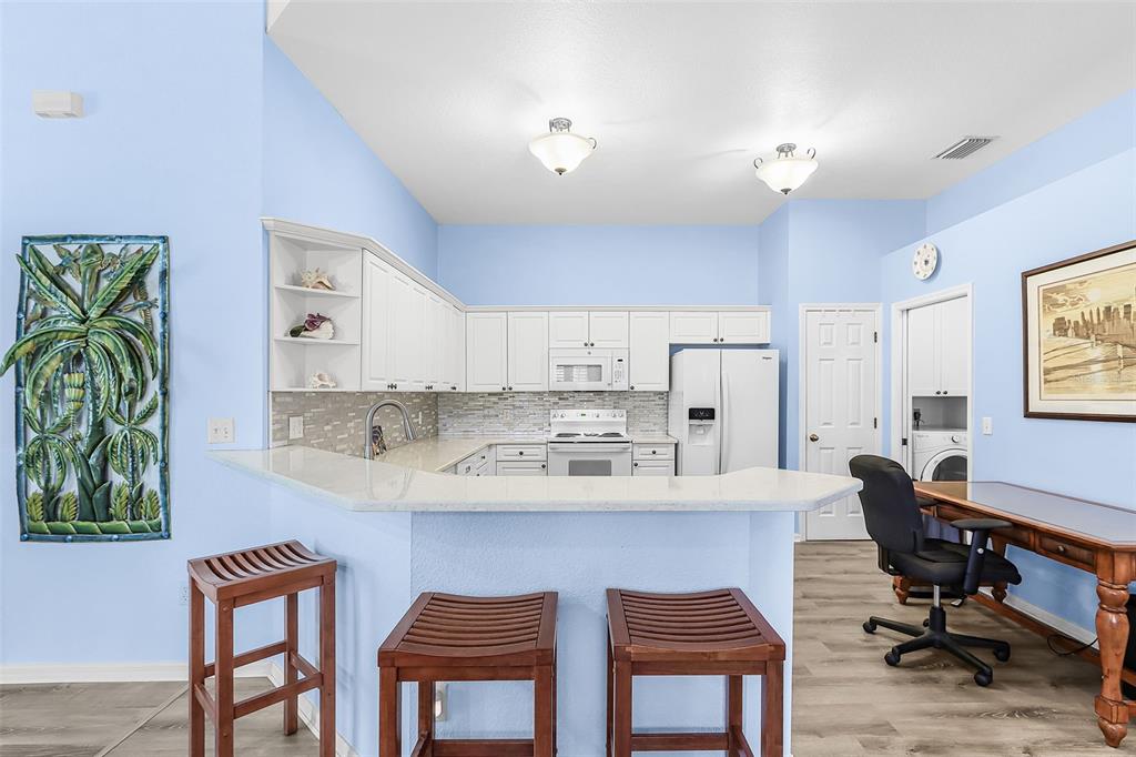 2031 Matecumbe Key Road Punta Gorda, FL 33955 - Photo 10 of 49 a view of kitchen with dining room and wooden floor