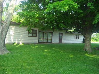 222 Maple Street Compton, IL 61318 - Photo 1 of 1 a view of a backyard with a large tree
