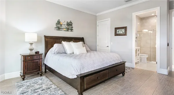 a spacious bedroom with a bed and a table