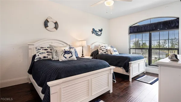 a bedroom with furniture and a window