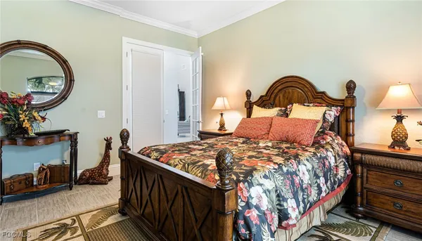 a bedroom with a bed and a dresser in it