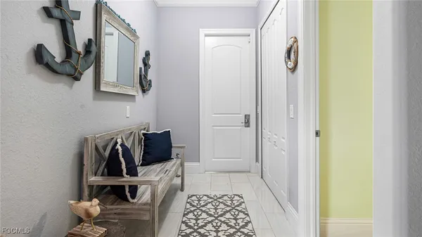 a view of a workspace with furniture and a potted plant
