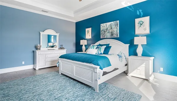 a bedroom with a bed and a lamp on table