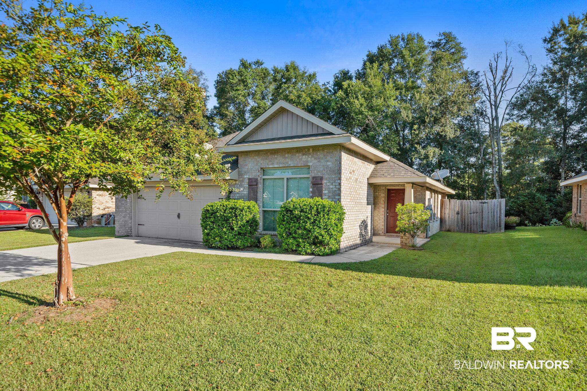 17069 Russet Court Foley, AL 36535 - Photo 3 of 27 View of front of house with a garage and a front lawn