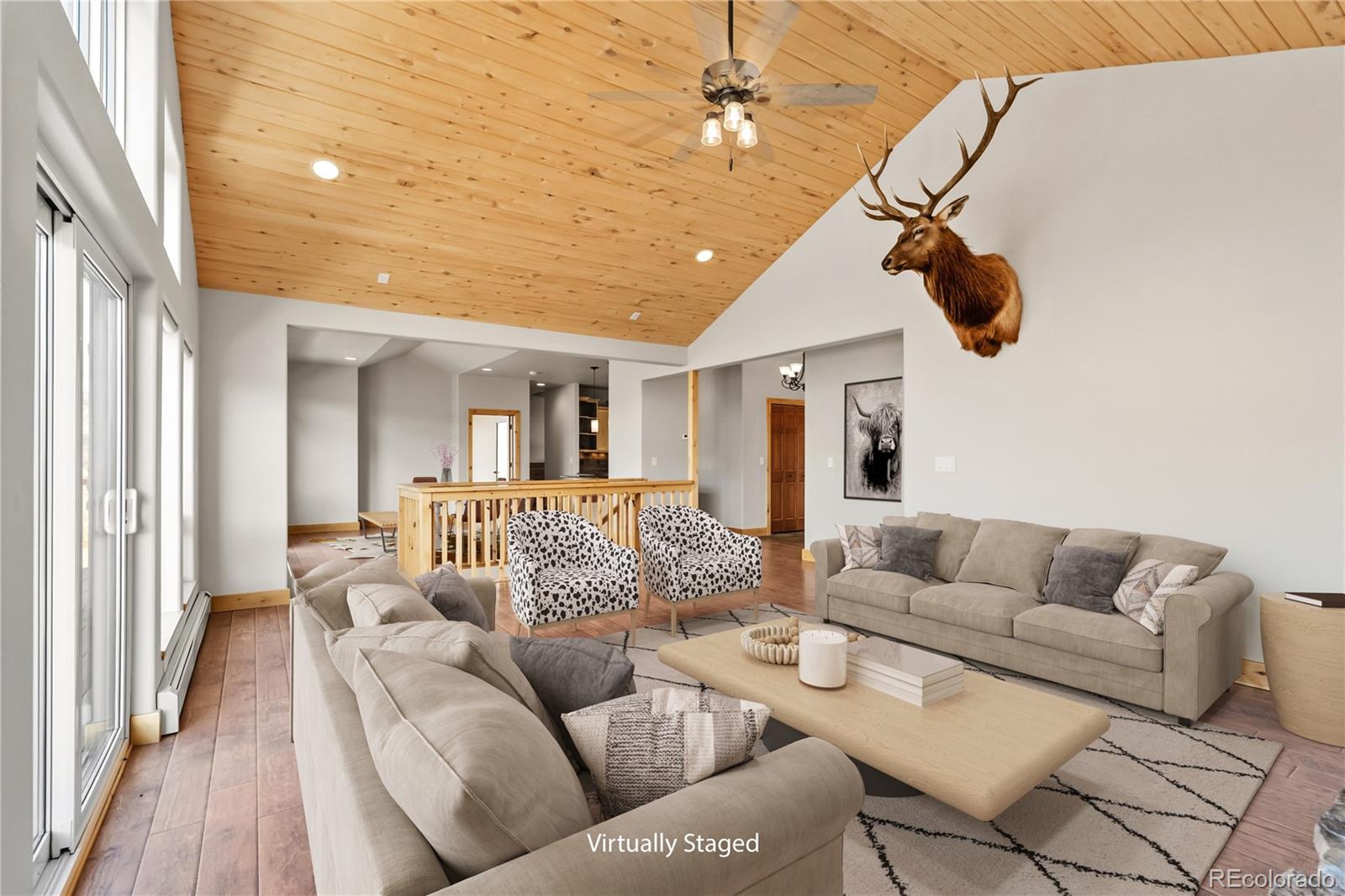 845 Elk Run Road Silverthorne, CO 80498 - Photo 11 of 50 a living room with furniture and a chandelier