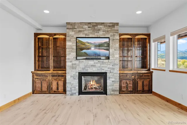 a kitchen with a stove a refrigerator and a sink