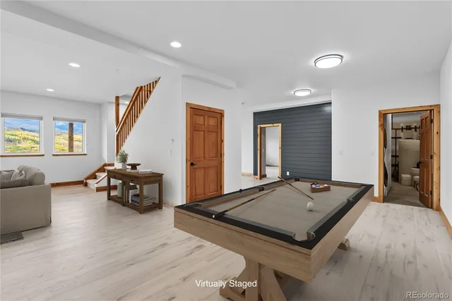 a view of a kitchen with a sink and a refrigerator