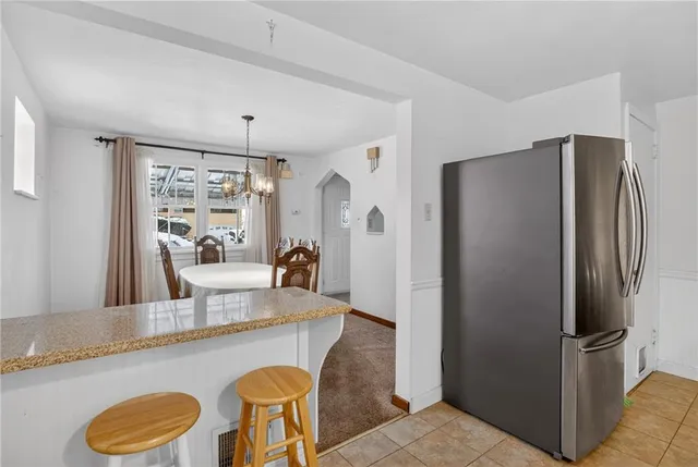 a kitchen with a sink stove and microwave