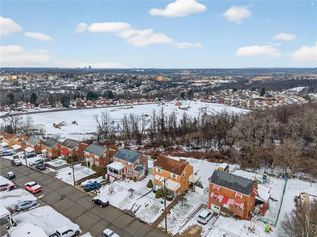 an aerial view of a parking space with city view