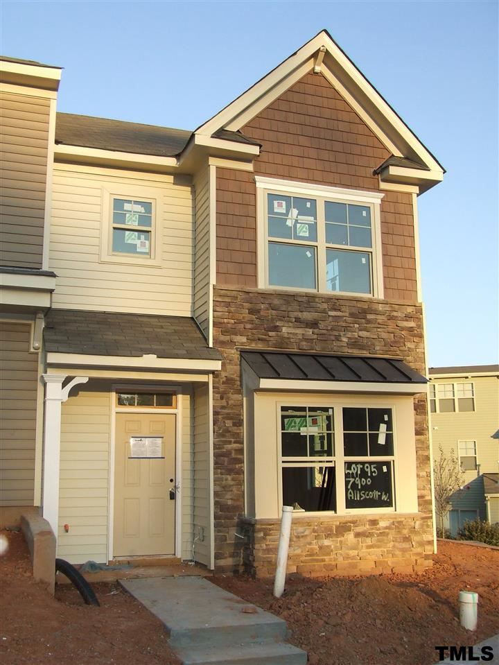 7900 Allscott Way Raleigh, NC 27612 - Photo 1 of 12 a front view of a house with a yard