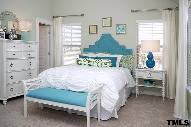 7900 Allscott Way Raleigh, NC 27612 - Photo 4 of 12 a bedroom with a bed and a dresser