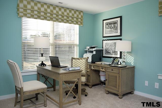 7900 Allscott Way Raleigh, NC 27612 - Photo 6 of 12 a view of a workspace with furniture and a window