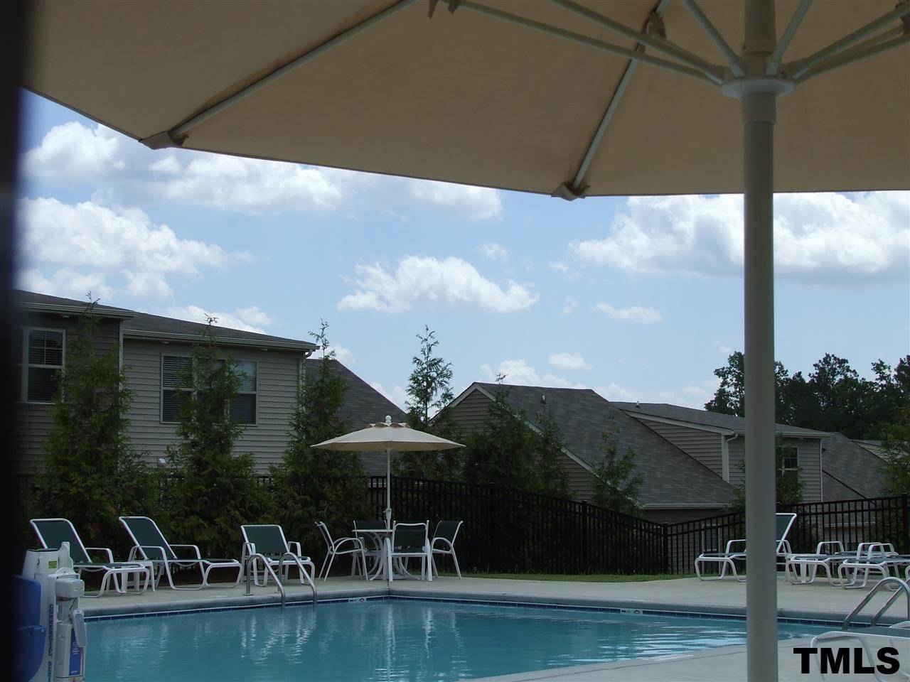 7900 Allscott Way Raleigh, NC 27612 - Photo 7 of 12 a view of a lake with a terrace