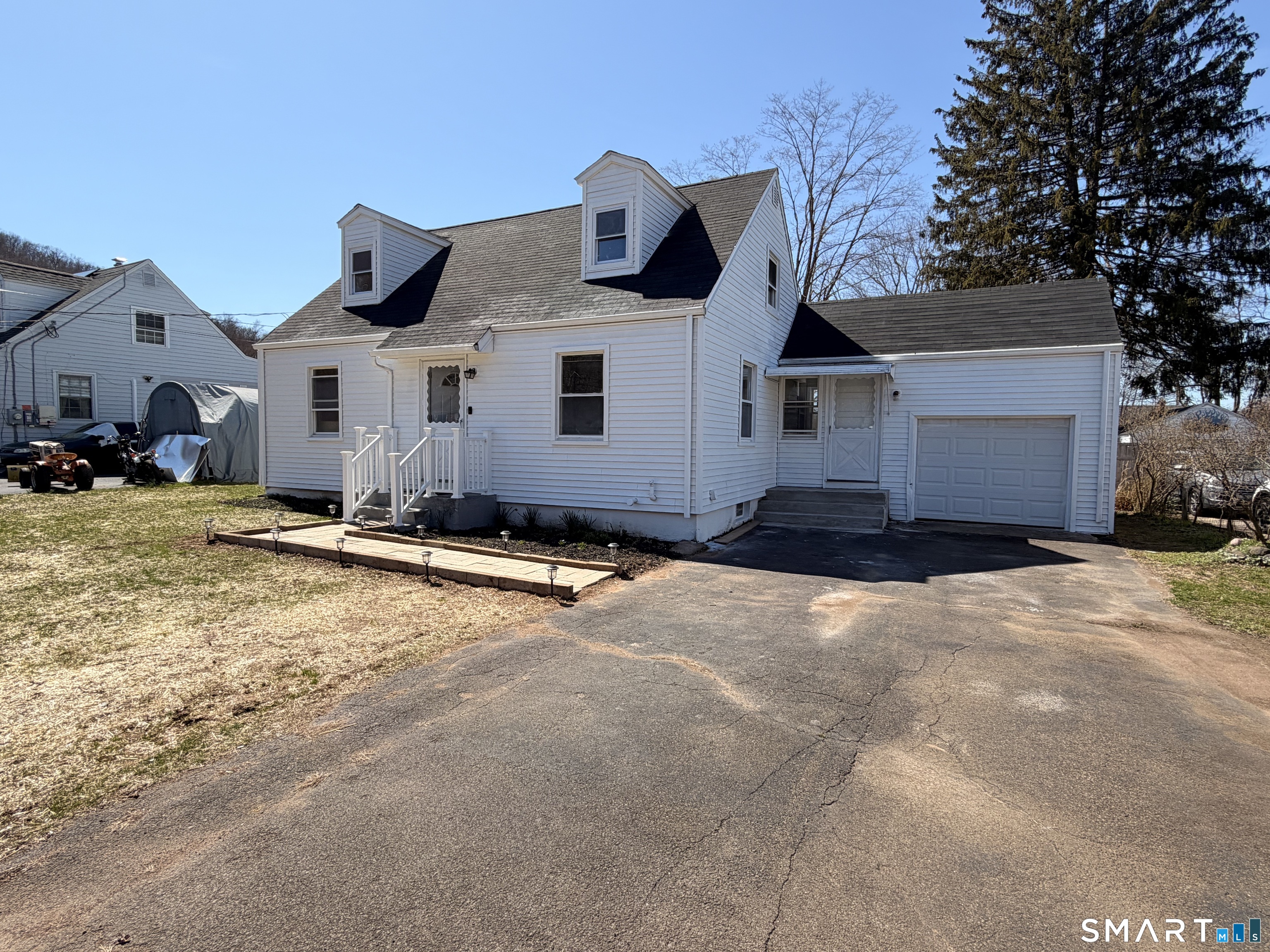 a front view of a house with a yard