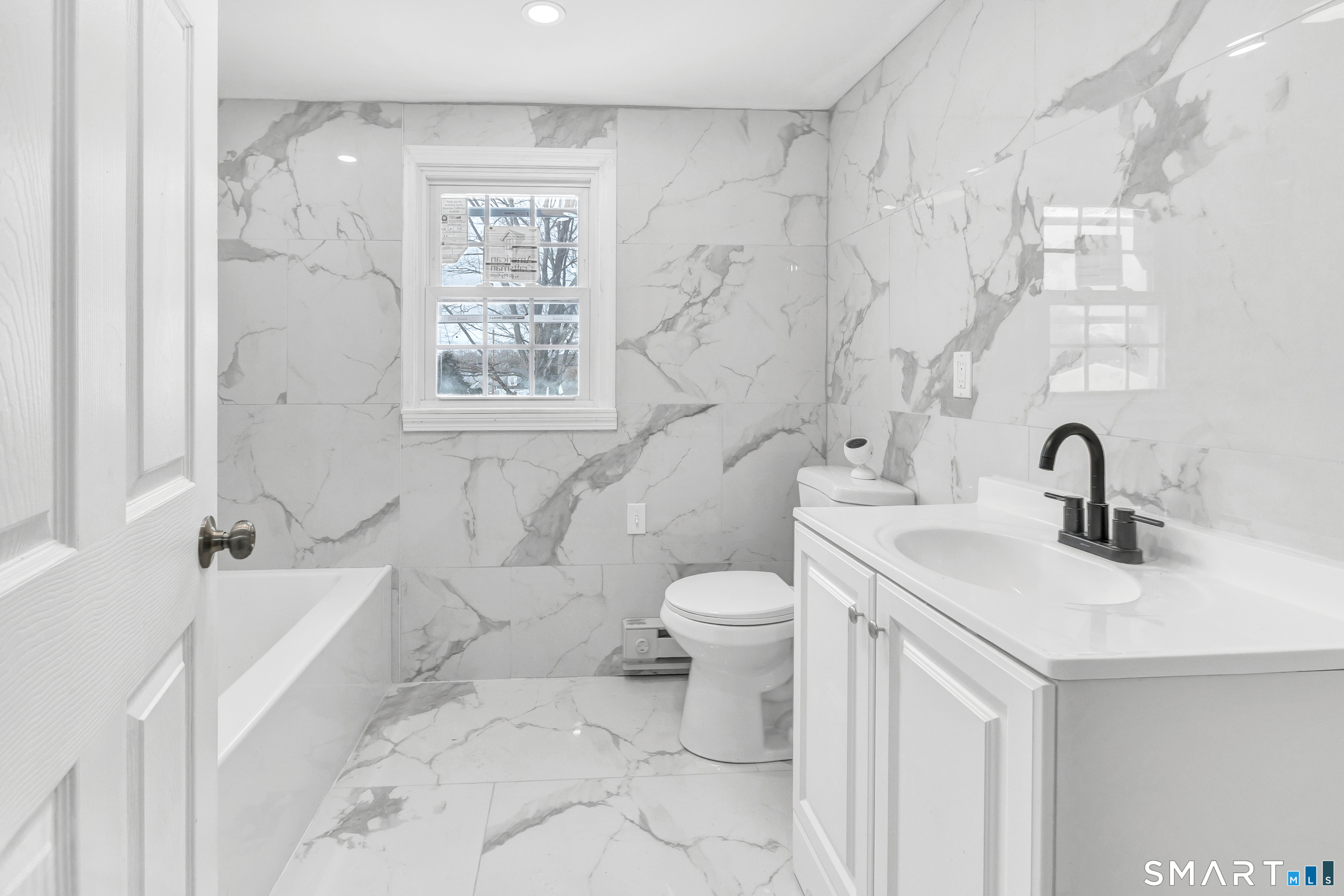 8 River Road East Haven, CT 06512 - Photo 12 of 45 a bathroom with a sink a toilet and a tub