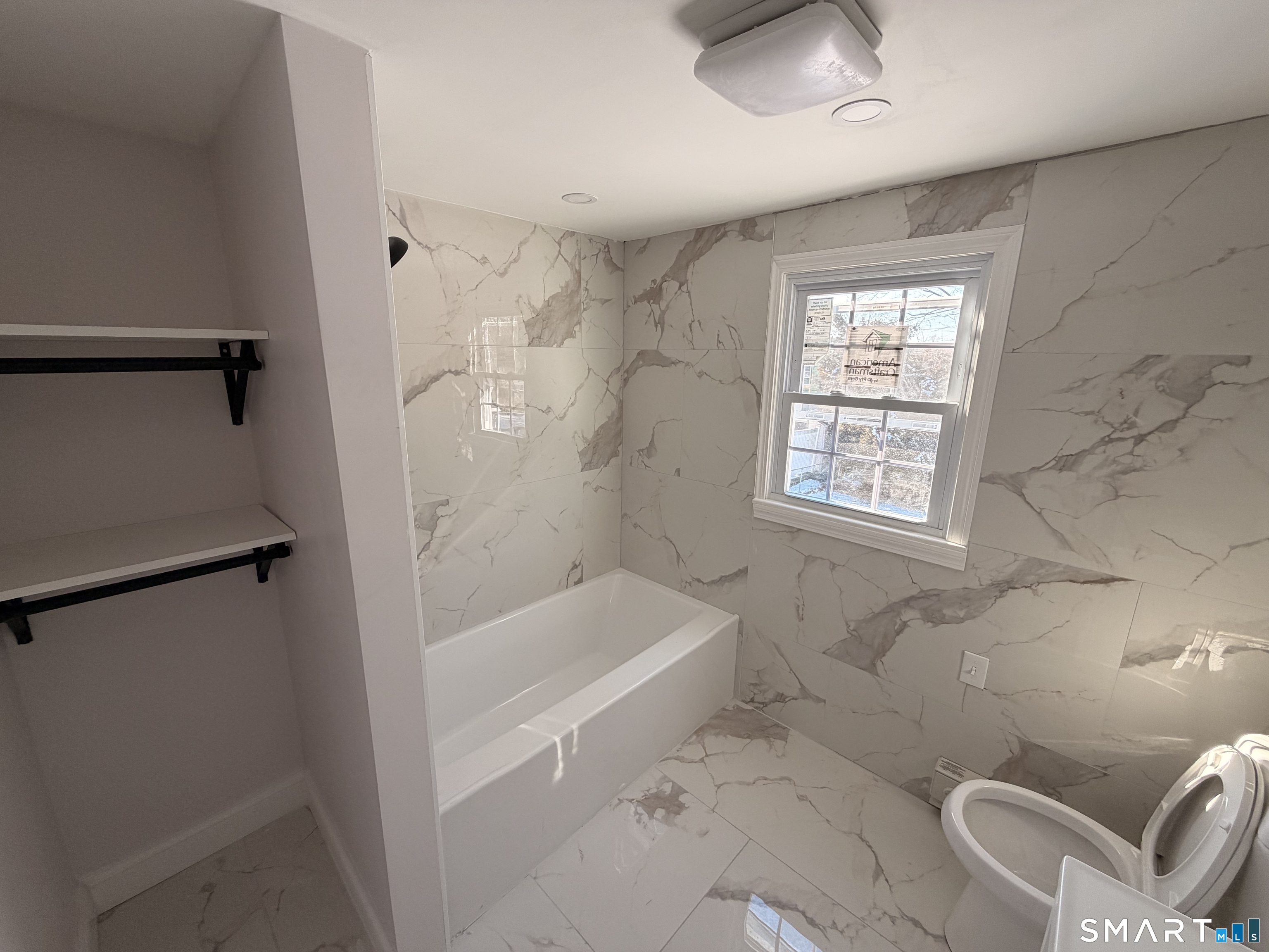 8 River Road East Haven, CT 06512 - Photo 13 of 45 a bath room with a bath tub and a shower