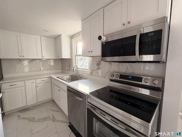 a kitchen with a stove and a microwave