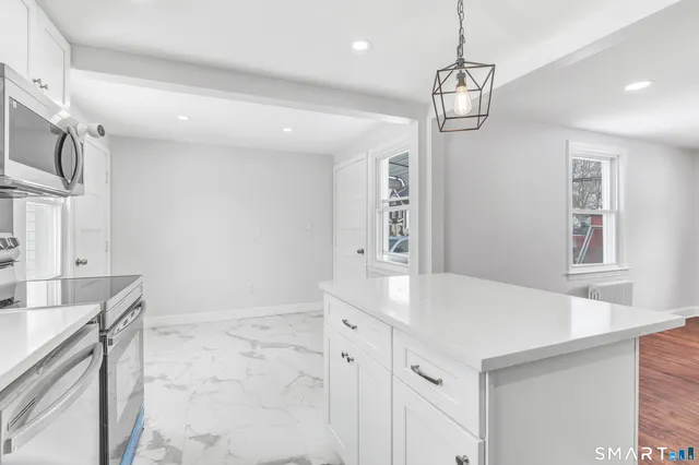 a very nice looking dining room with a chandelier