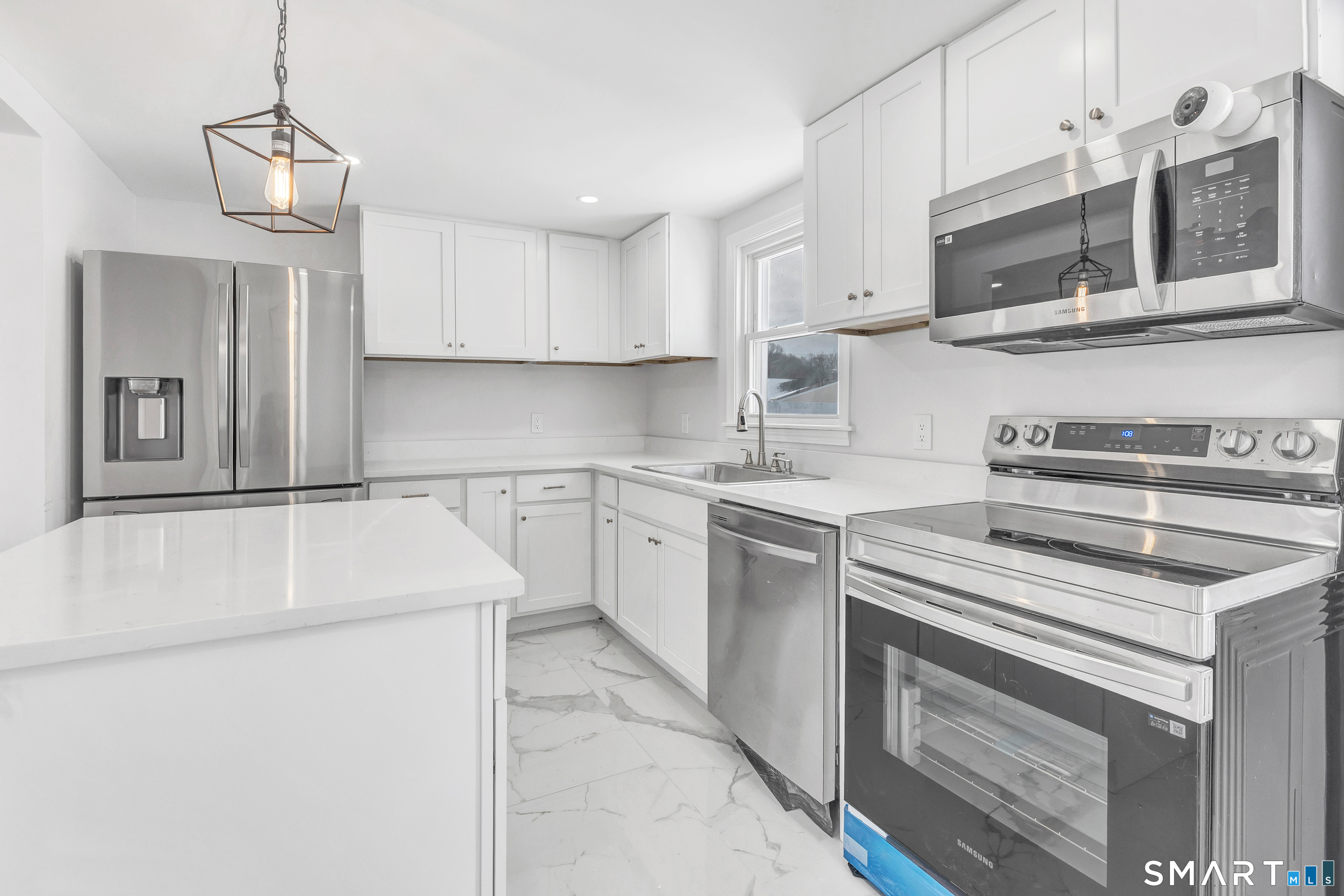 8 River Road East Haven, CT 06512 - Photo 19 of 45 a kitchen with stainless steel appliances granite countertop a sink and a stove