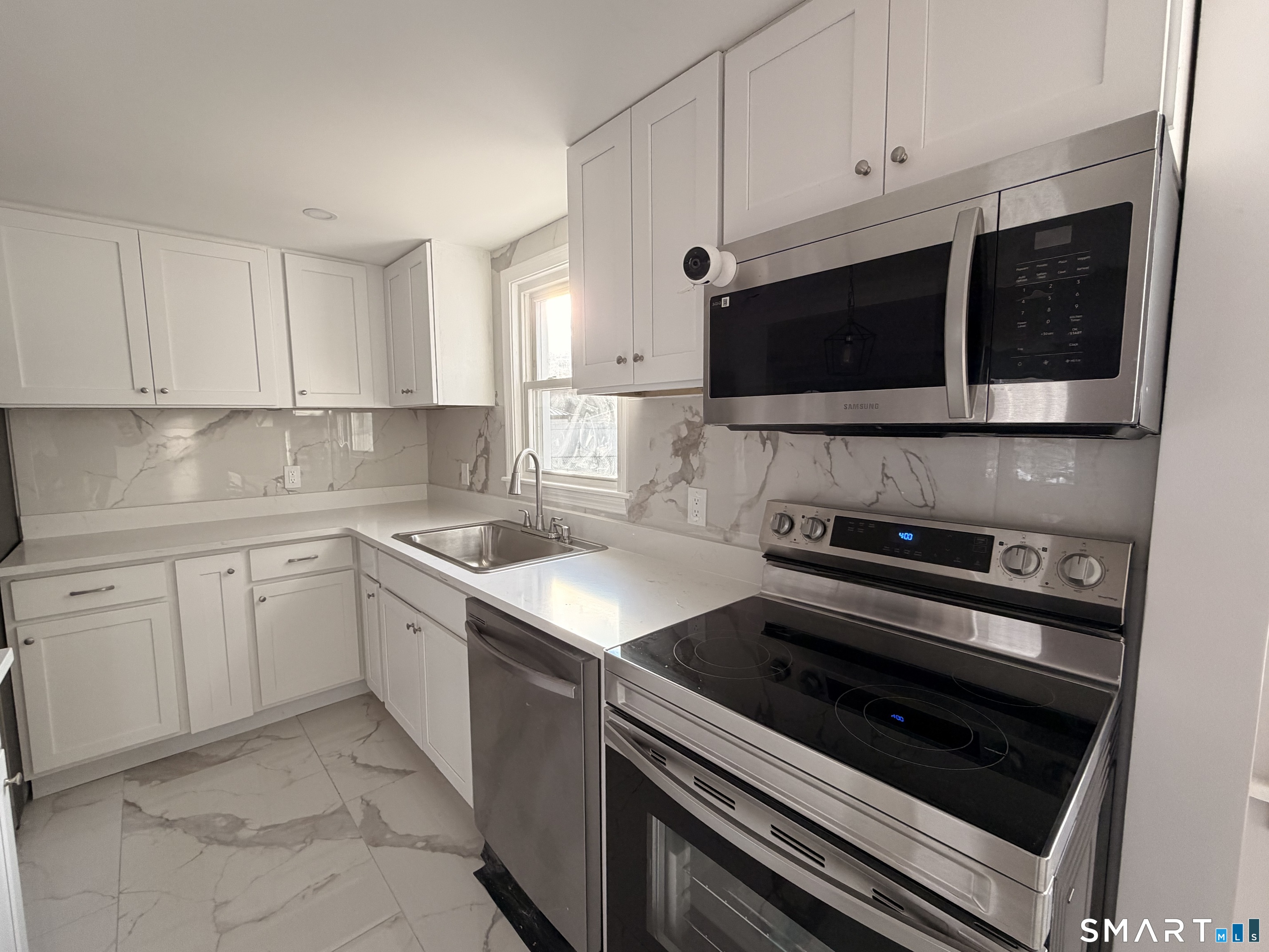 8 River Road East Haven, CT 06512 - Photo 20 of 45 a kitchen with a stove and a microwave