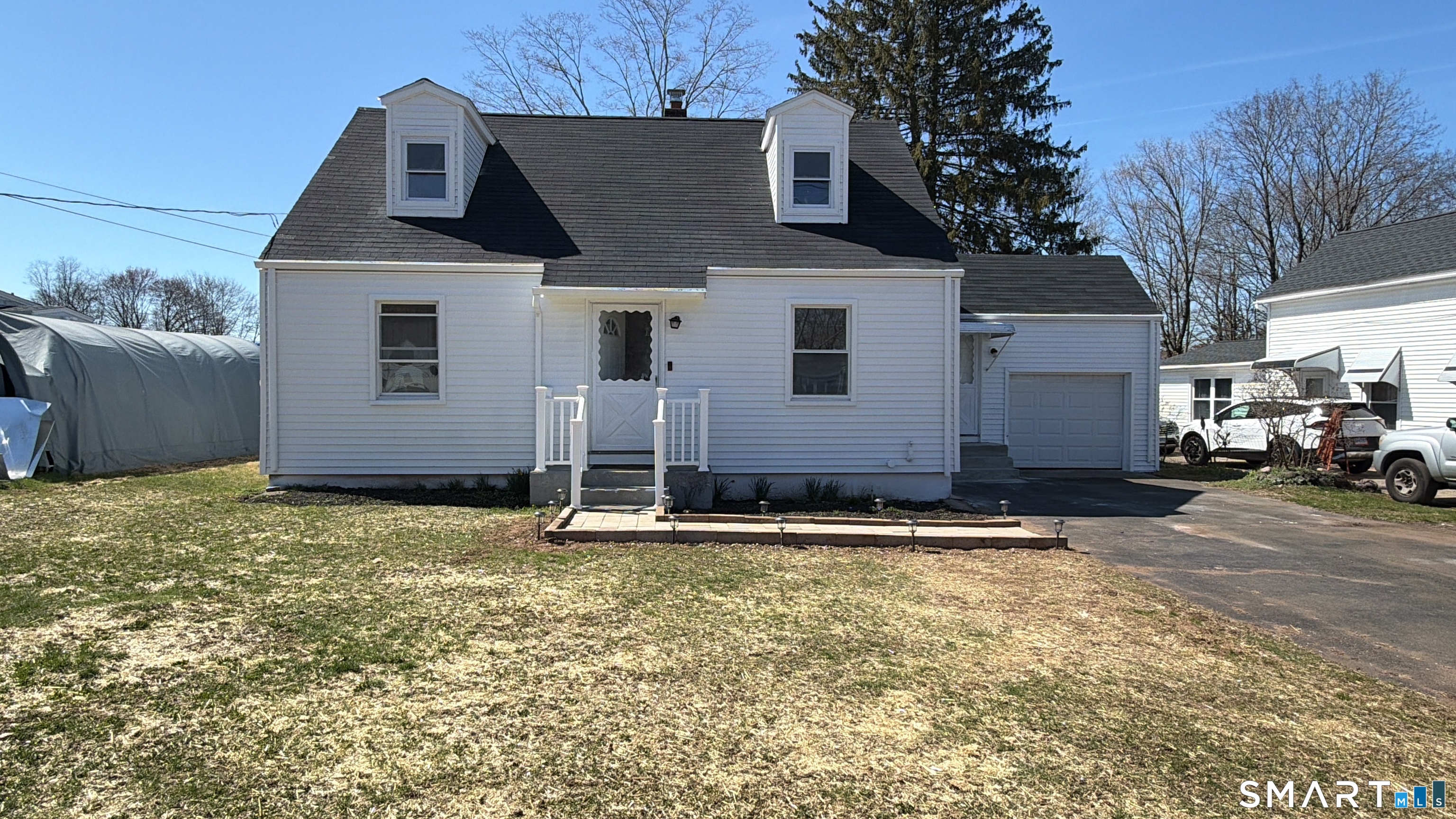 8 River Road East Haven, CT 06512 - Photo 2 of 45 a house with yard in front of it