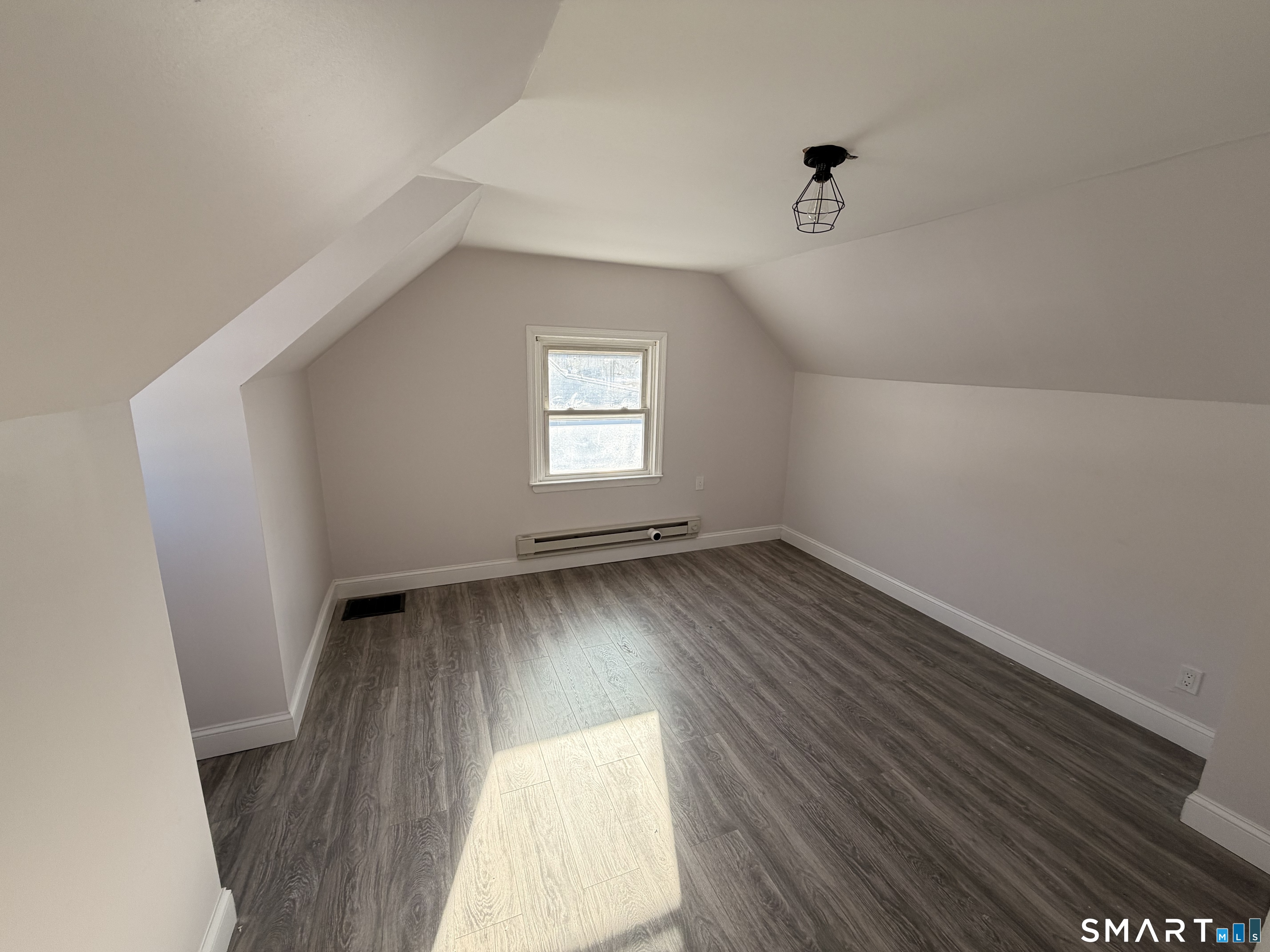 8 River Road East Haven, CT 06512 - Photo 35 of 45 an empty room with wooden floor and windows