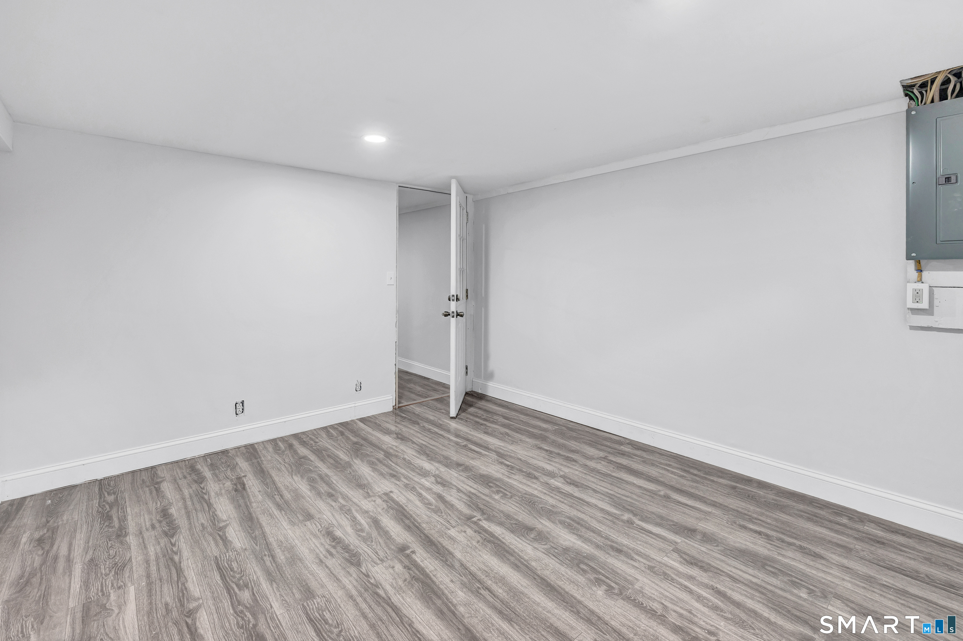 8 River Road East Haven, CT 06512 - Photo 36 of 45 a view of an empty room with wooden floor