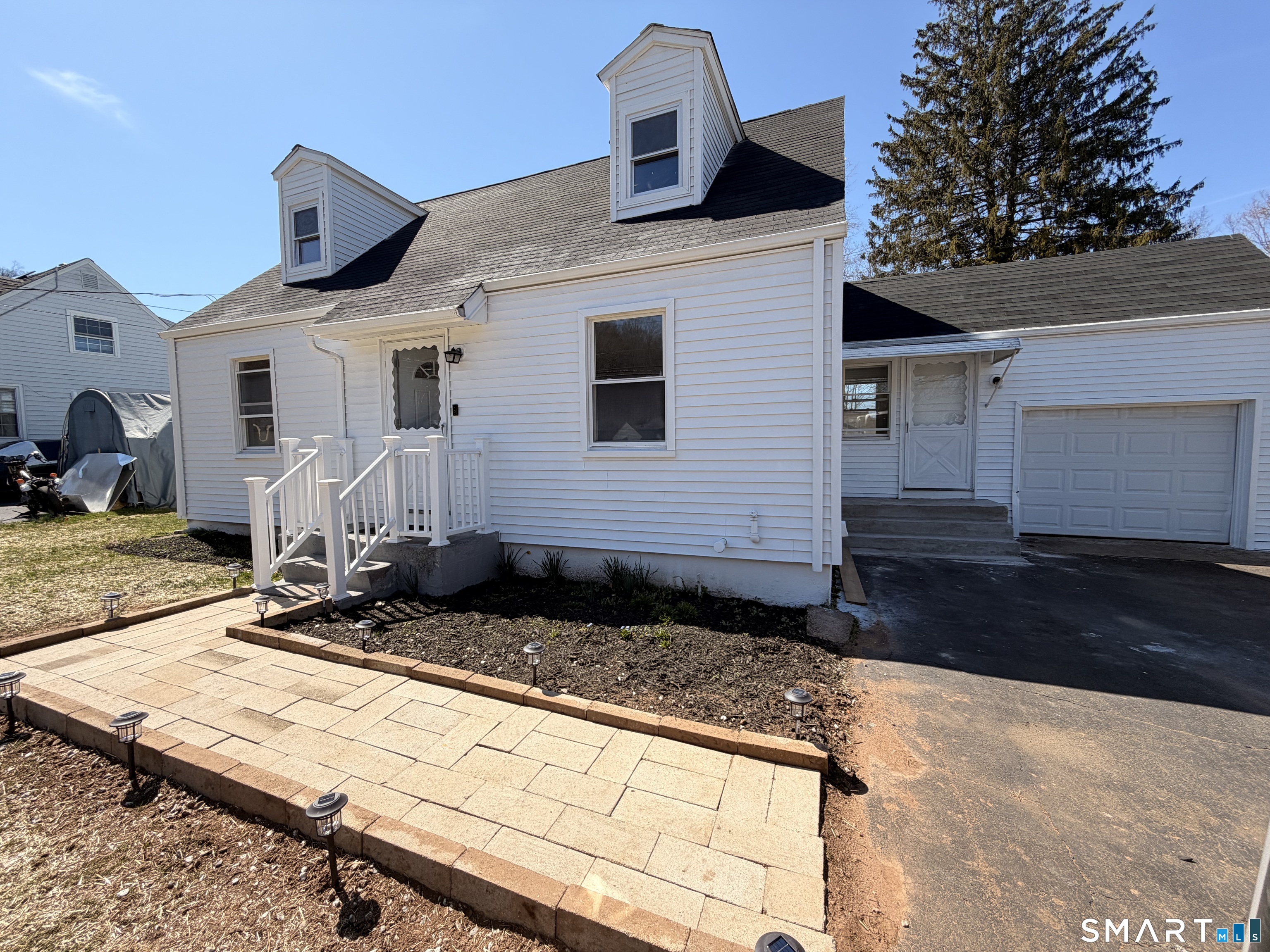 8 River Road East Haven, CT 06512 - Photo 5 of 45 a front view of a house with a yard